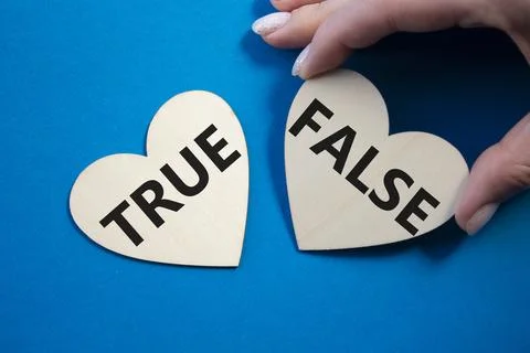 True or False symbol. Concept word True or False on wooden hearts. Business.. Stock Photos