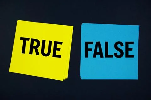True or False text with sticky note on black background Stock Photos