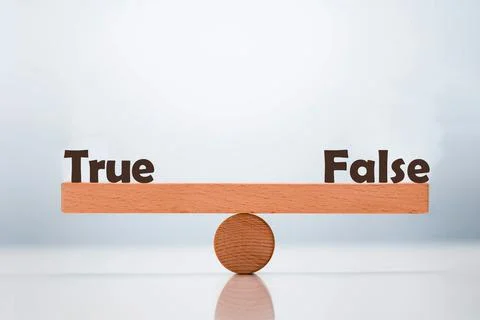 True vs False word balancing on seesaw choice concept Stock Photos