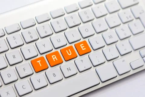 TRUE writing on white keyboard Stock Photos