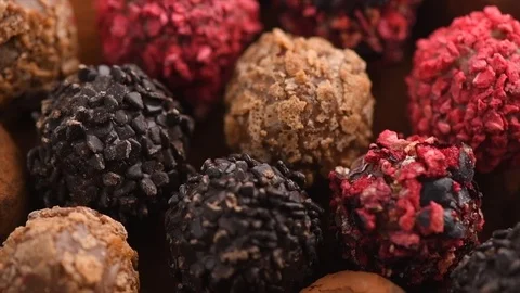 Truffle chocolates. Assorted chocolate praline candies background Stock Footage 102633080