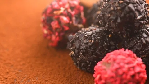 	Truffle Chocolates. Assorted Chocolate praline Candies rotate close-up Video stock 104970682