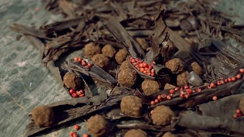 Truffles in dark chocolate with red pepper and chocolate chips. Video stock 74567334