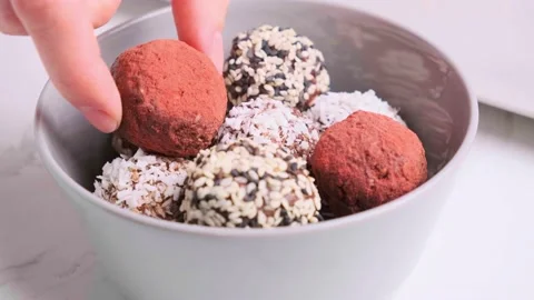 Truffles made from nuts, seeds, cocoa, dates and superfood powder. Stock Footage 168363958
