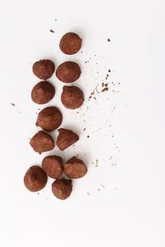 Truffles pattern, top view flat lay of various chocolate sweets Stock Photos