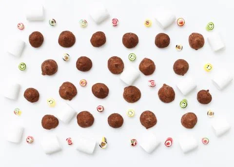 Truffles pattern, top view flat lay of various chocolate Stock Photos