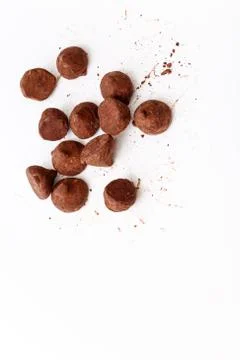 Truffles pattern, top view flat lay of various chocolate sweets Stock Photos