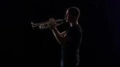 Man Plays on the Tuba Slow Melody. White Studio Background, People