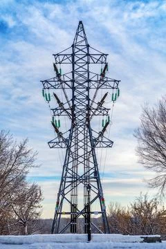 Truss support of a high-voltage power line. Winter Stock Photos