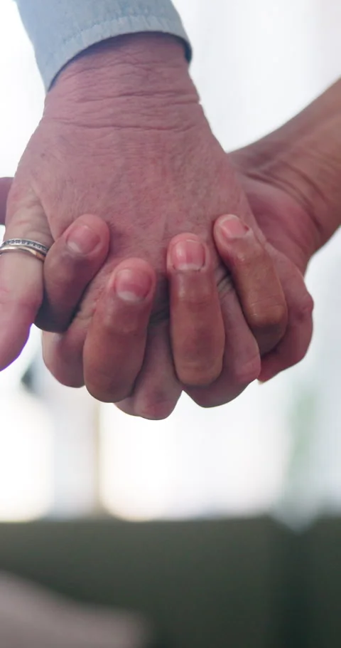 Trust, holding hands and couple in home with love, commitment and security in Stock Footage 338222247