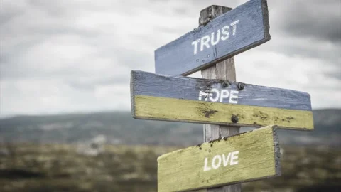 Trust hope love text quote on wooden signpost outdoors, written on the ukrani Stock Footage 171028501