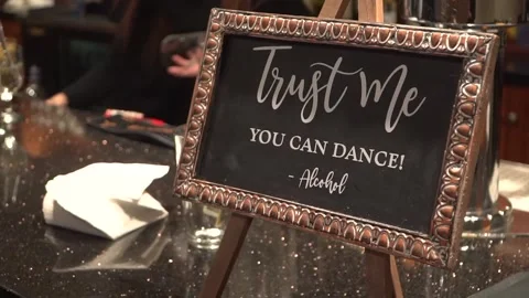 "Trust me you can dance" sign at wedding reception Stock Footage 149604091