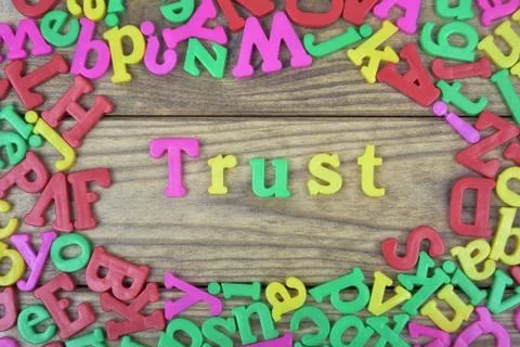 Trust on wooden table Stock Photos