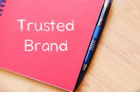 Trusted brand write on notebook Stock Photos