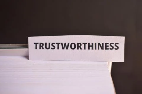 Trustworthiness Paper Tab Between Book Pages for Honesty, Credibility and P.. Fotos Stock