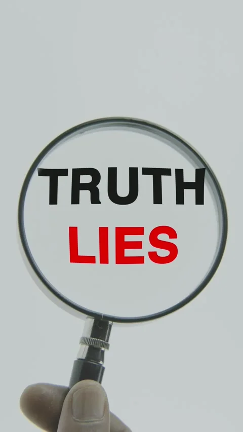 Truth Lies text or word highlighted by a magnifying glass in a hand on a white Stock Footage 303526629
