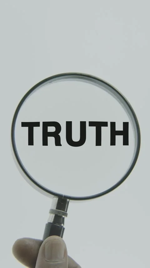 Truth text or word highlighted by a magnifying glass in a hand on a white Stock Footage 303526828