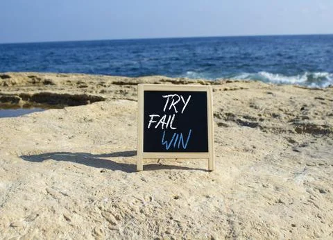 Try Fail Win symbol. Blackboard with words Try Fail Win. Beautiful sea back.. 写真素材