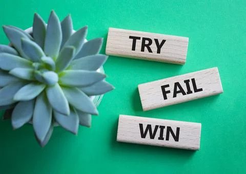 Try Fail Win symbol. Concept words Try Fail Win on wooden blocks. Beautiful.. Stock Photos