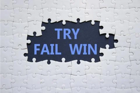 Try Fail Win symbol. Concept words Try Fail Win on white puzzle. Beautiful .. Stock Photos