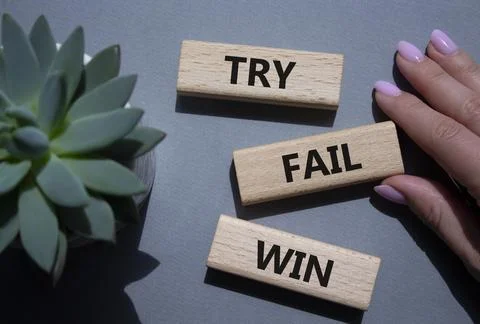 Try Fail Win symbol. Concept words Try Fail Win on wooden blocks. Beautiful.. Stock Photos