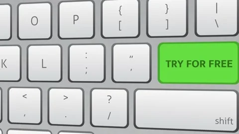 Try for free green key button being clicked on white keyboard. Stock-Footage 221460217