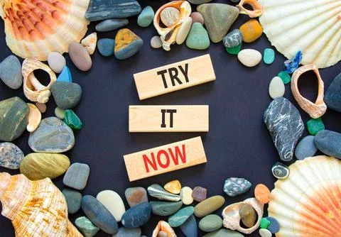 Try it now words symbol. Concept words Try is now on beautiful wooden block.. Stock Photos