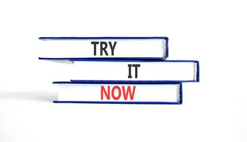 Try it now words symbol. Concept words Try is now on beautiful books. Beaut.. Stock Photos