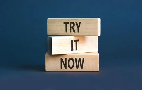 Try it now words symbol. Concept words Try is now on beautiful wooden block.. Stock Photos