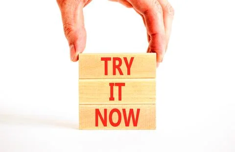 Try it now words symbol. Concept words Try is now on beautiful wooden block.. Stock Photos