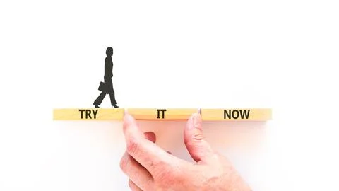Try it now words symbol. Concept words Try is now on beautiful wooden block.. Stock Photos