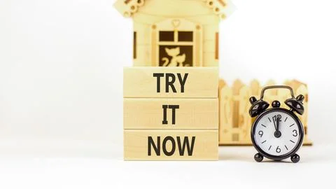 Try it now words symbol. Concept words Try is now on beautiful wooden blocks. Stock Photos