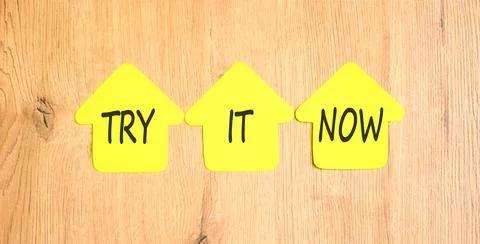 Try it now words symbol. Concept words Try is now on beautiful yellow paper.. Stock Photos