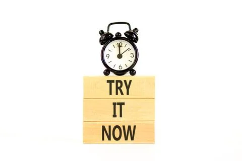 Try it now words symbol. Concept words Try is now on beautiful wooden block.. Stock Photos