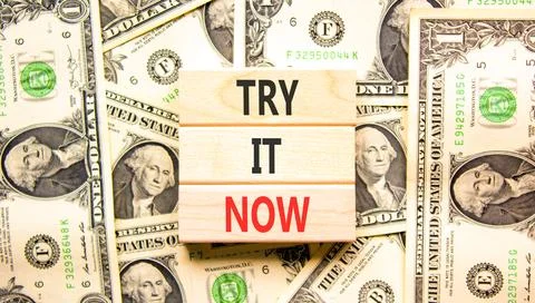 Try it now words symbol. Concept words Try is now on beautiful wooden block.. Stock Photos