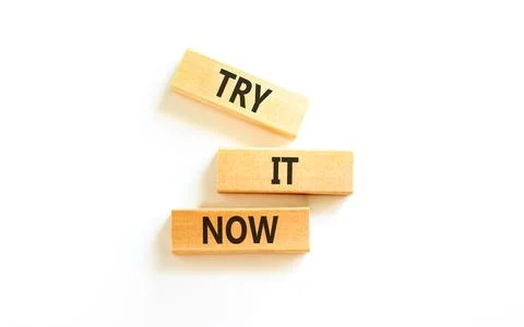 Try it now words symbol. Concept words Try is now on beautiful wooden block.. Stock Photos