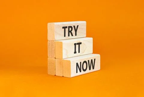 Try it now words symbol. Concept words Try is now on beautiful wooden block.. Stock Photos
