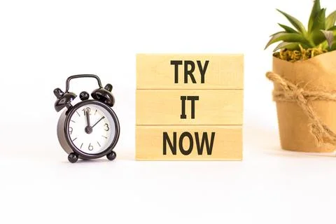 Try it now words symbol. Concept words Try is now on beautiful wooden block.. Stock Photos