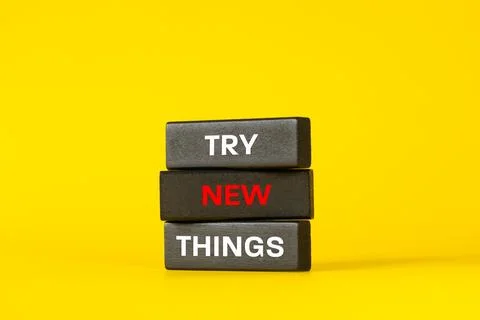 Try new Things phrase. Try new Things symbol on expressive black wooden  Stock Photos