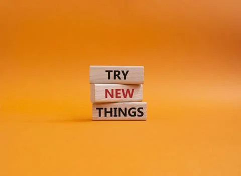 Try new Things symbol. Concept words Try new Things on wooden blocks. Beaut.. Stock Photos