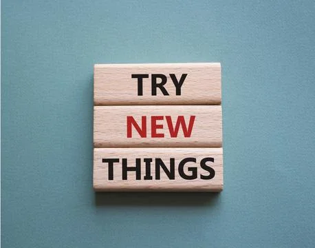 Try new Things symbol. Concept words Try new Things on wooden blocks. Beaut.. 스톡 사진