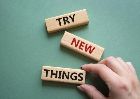 Try new Things symbol. Concept words Try new Things on wooden blocks. Busin.. Stock Photos