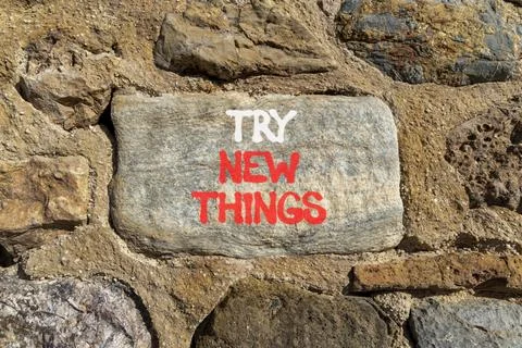 Try new things symbol. Concept words Try new things on beautiful grey stone.. Foto stock