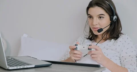 Trying to beat this game and answer client call at the same time. Stock Footage 120382622