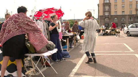 Trying on clothes at a flea market Video stock 54647547