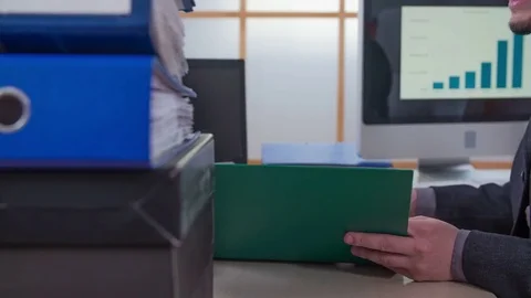 Trying to find specific documents in a folder Stock Footage 74455407