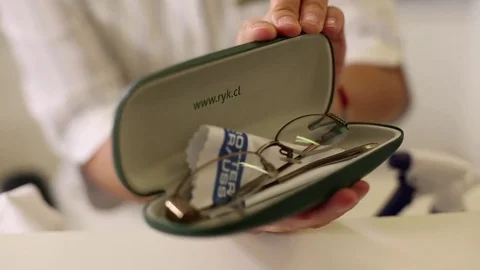 Trying on glasses Stock Footage 77050462