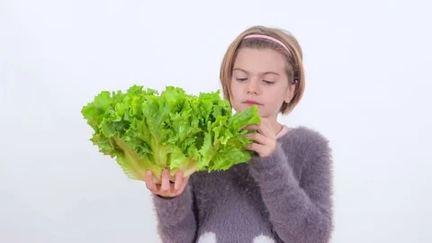 Trying a green lettuce Stock Footage 83724527