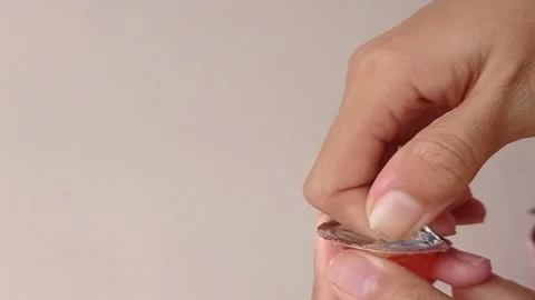 Trying hard to open a small jar of tomato sauce Stock Footage 150215099