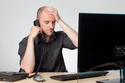 Trying to help over the phone Stock Photos